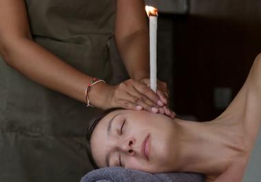 Ear candle treatment at clinic in Canary Wharf