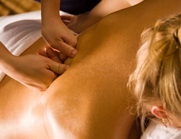 Lady having deep tissue back massage
